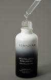 Pipette releasing a drop of Lumazen Revitalizing Edelweiss Hair Tonic into the open bottle