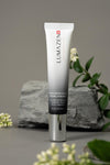 Lumazen Nourishing Edelweiss Eye Cream, 15 ml tube on grey stone